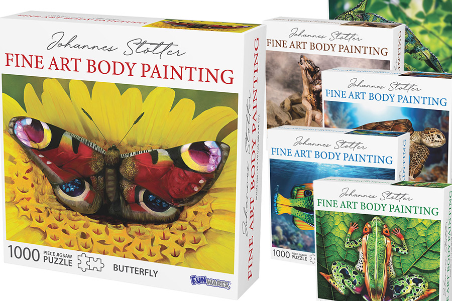 Sammlung von Puzzleboxen mit Motiven der Körperkunst von Johannes Stötter, darunter ein Schmetterling auf einer Blume, ein Frosch, ein Fisch und weitere Tier-Illusionen, die durch Bodypainting entstehen.